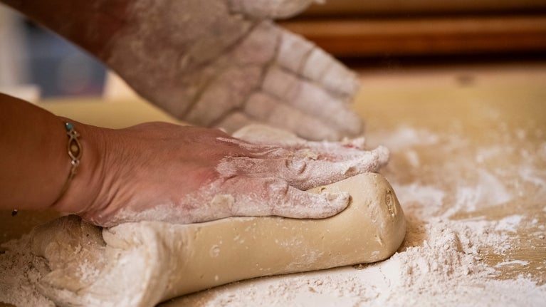 two hands roll out mouldings for the new frame